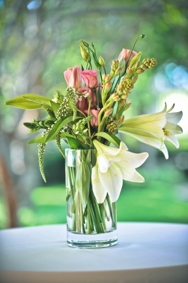 floral centerpiece with white lilies - wedding photo by Australia based wedding photographer Natasha Du Preez